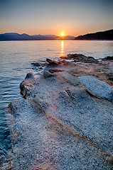 Image showing Beautiful Mountain Lake Shoreline on a sunny Day