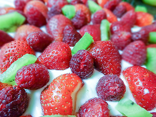 Image showing Strawberry & kiwi birthday  cake with candles