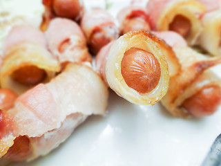 Image showing hot dog weiners in a bacon blanket