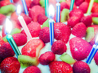 Image showing Strawberry & kiwi birthday  cake with candles