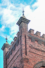 Image showing old brick church with blue sky and clouds