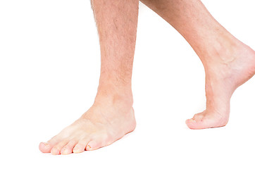 Image showing Young male person walking barefeet isolated on white