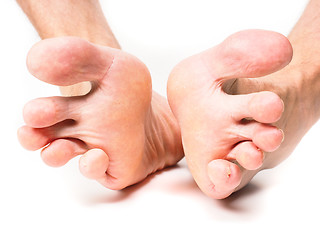 Image showing Male person spreading toes towards white background