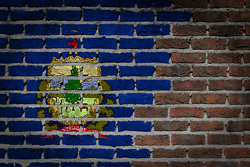 Image showing Brick wall texture with flag