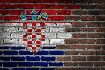 Image showing Brick wall texture with flag