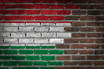 Image showing Brick wall texture with flag