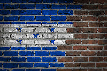 Image showing Brick wall texture with flag