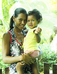 Image showing editorial latina woman mother with baby daughter