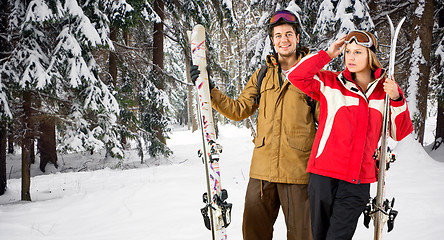 Image showing Winter forest with skiers