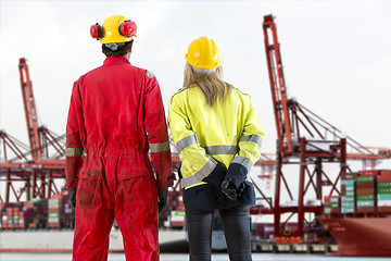 Image showing Dockers looking at a container terminal