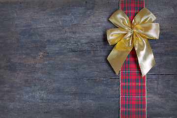 Image showing Christmas  ribbon and golden gift bow