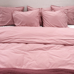 Image showing Bed with pink bedclothes