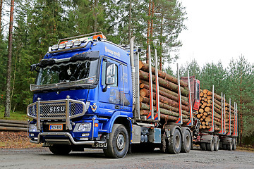 Image showing Blue Sisu Polar Timber Truck Hauls Spruce Logs