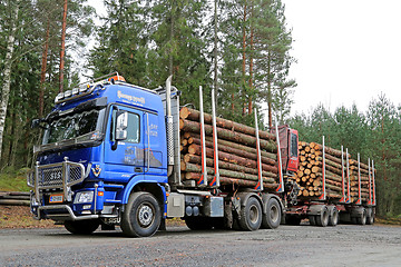 Image showing Blue Sisu Polar Timber Truck Hauls Timber