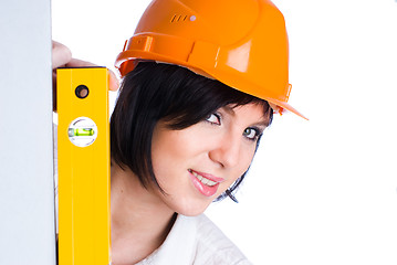 Image showing Pretty girl in helmet with level