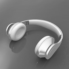 Image showing White headphones isolated on a red background 