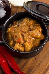 Image showing homemade hot goulash on wooden table