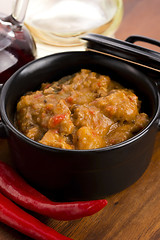 Image showing homemade hot goulash on wooden table