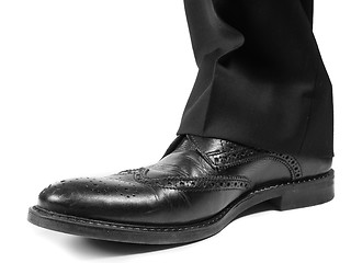 Image showing Closeup of male suit in black worn shoes towards white