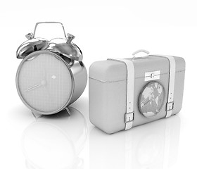 Image showing Suitcases for travel and clock