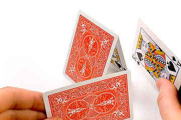 Image showing Hands building a house of cards