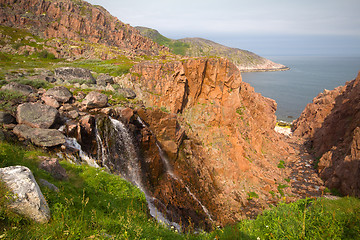 Image showing big northern beautiful waterfalls on the seashore