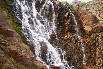 Image showing big northern beautiful waterfalls on the seashore