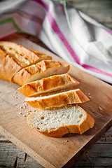 Image showing french bread baguette and linen napkin