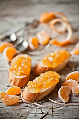 Image showing pieces of baguette with orange marmalade 