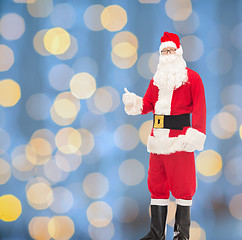 Image showing man in costume of santa claus showing thumbs up