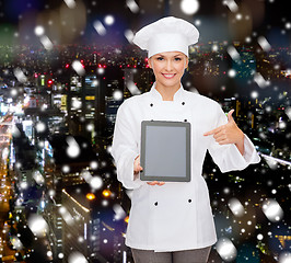 Image showing smiling female chef with tablet pc blank screen