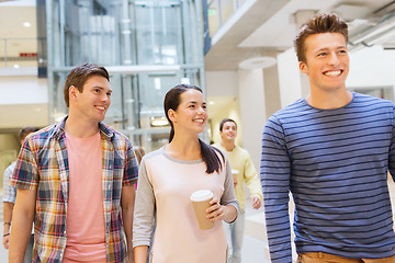 Image showing group of smiling students with paper coffee cups