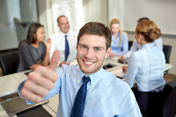 Image showing group of smiling businesspeople meeting in office