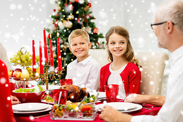 Image showing smiling family having holiday dinner at home