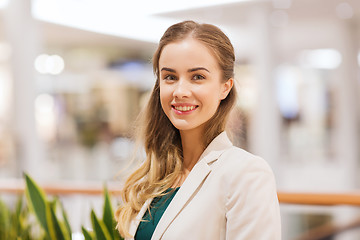 Image showing happy young woman in mall or business center