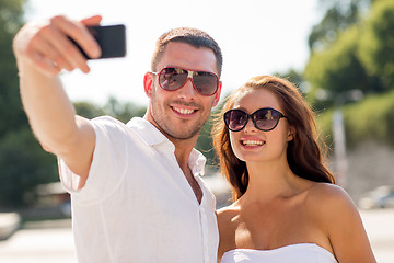 Image showing smiling couple in city