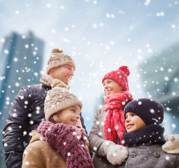 Image showing happy family in winter clothes outdoors