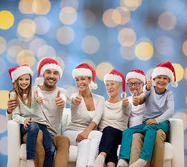 Image showing happy family sitting on couch