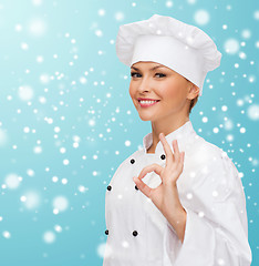 Image showing smiling female chef showing ok hand sign