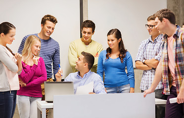 Image showing group of students and teacher with laptop