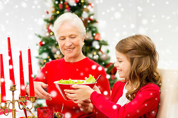 Image showing smiling family having holiday dinner at home