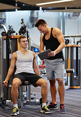 Image showing men exercising on gym machine
