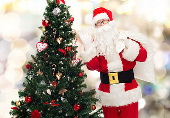 Image showing santa claus with bag and christmas tree