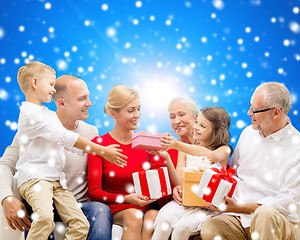 Image showing smiling family with gifts