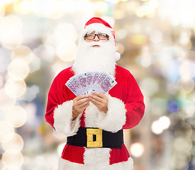 Image showing man in costume of santa claus with euro money