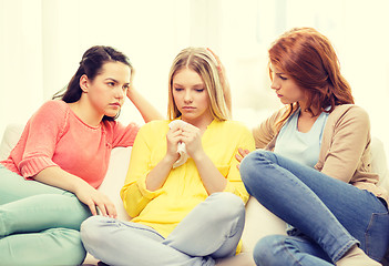 Image showing two teenage girls comforting another after breakup