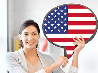 Image showing smiling woman with text bubble of american flag