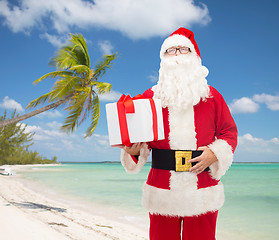 Image showing man in costume of santa claus with gift box