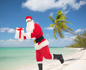 Image showing man in costume of santa claus with gift box