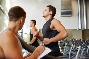 Image showing men exercising on treadmill in gym